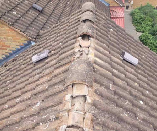 This is a photo if a roof ridge which has missing tiles. The ridge tiles are being replaced by NRS Roofing Thrapston